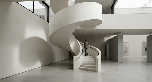 A quiet spiral staircase in a modern gallery